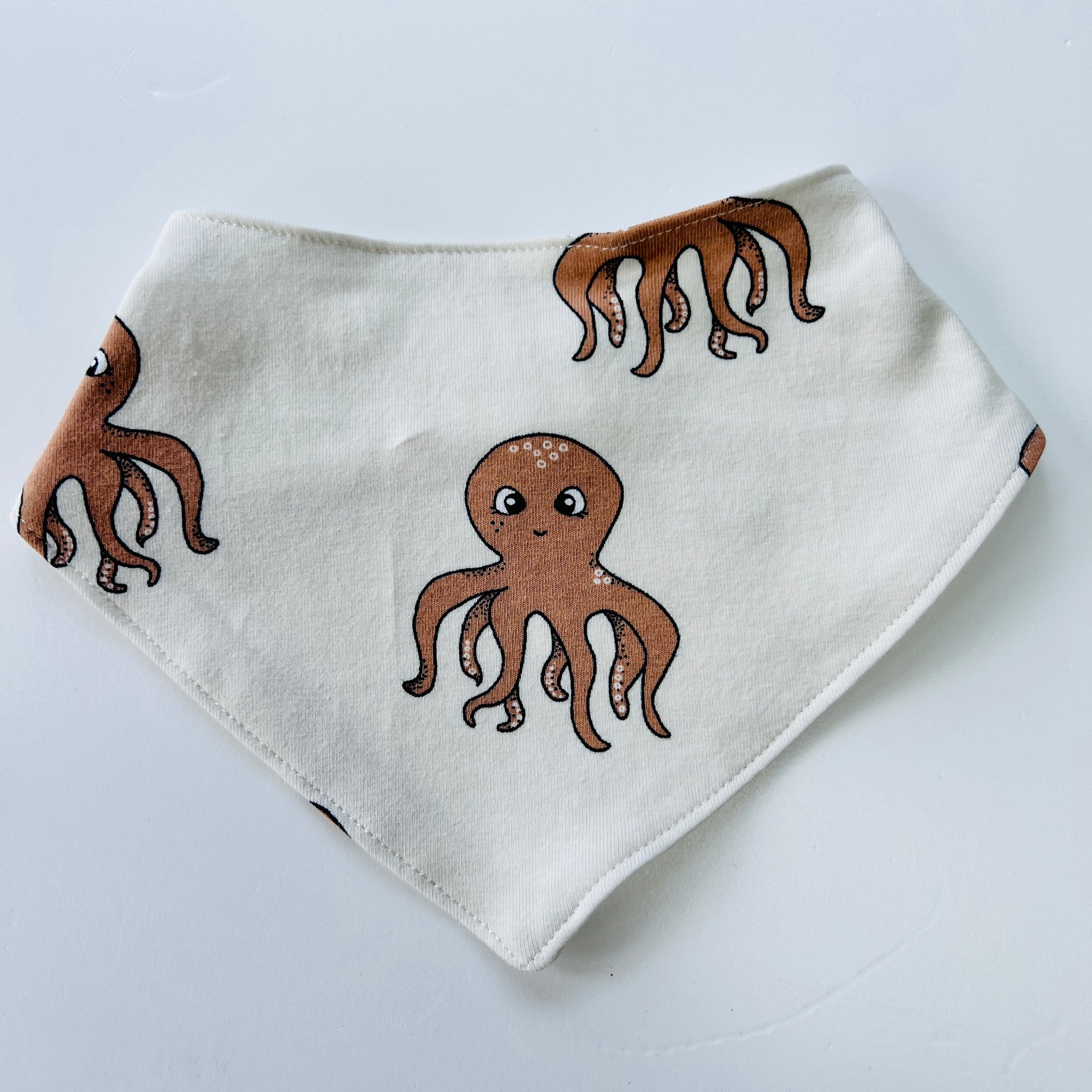 Eddie & Bee organic cotton Baby Dribble bib  in oat "Octopus" print.