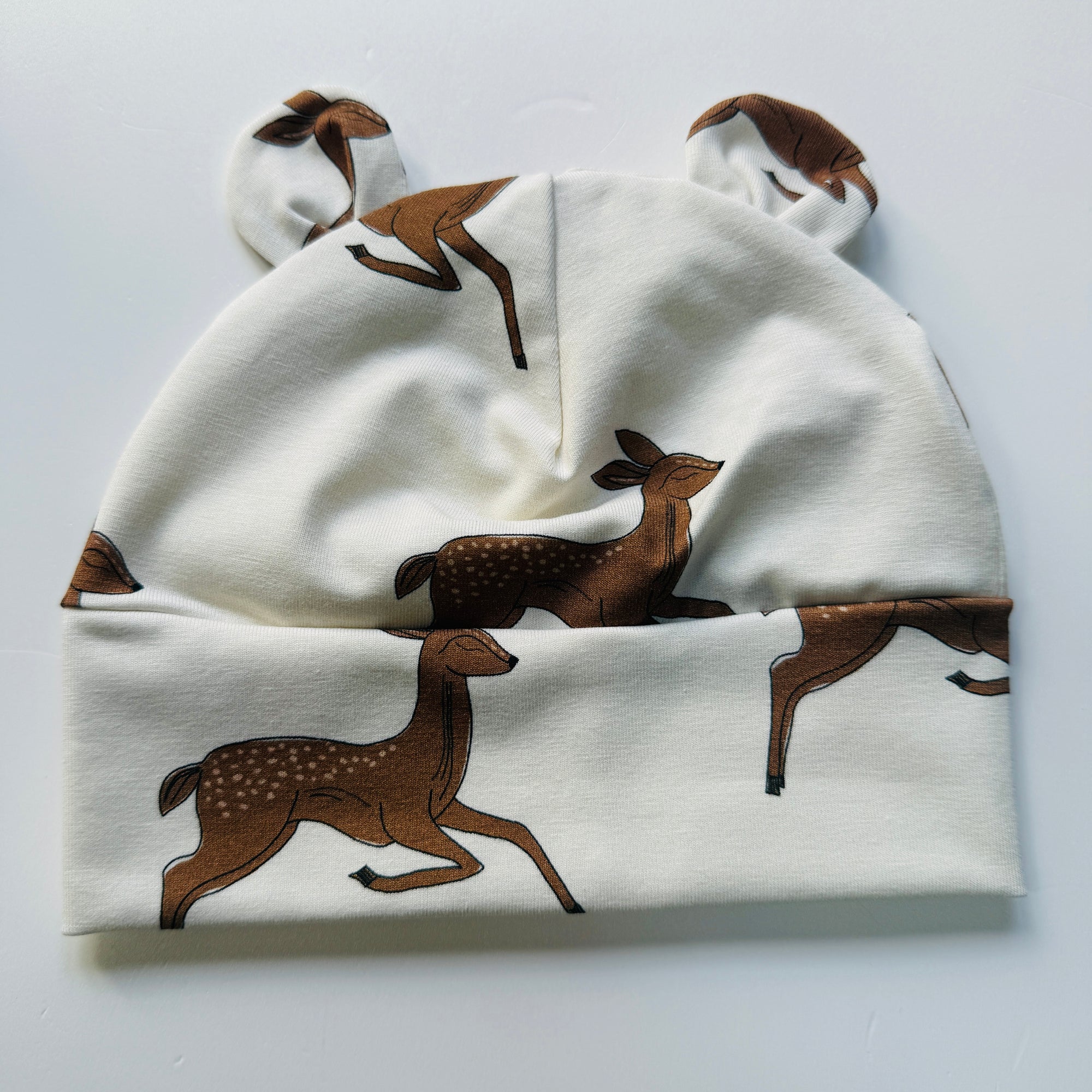 Eddie & Bee organic cotton Baby hat with ears  in Cream "Deer" print.