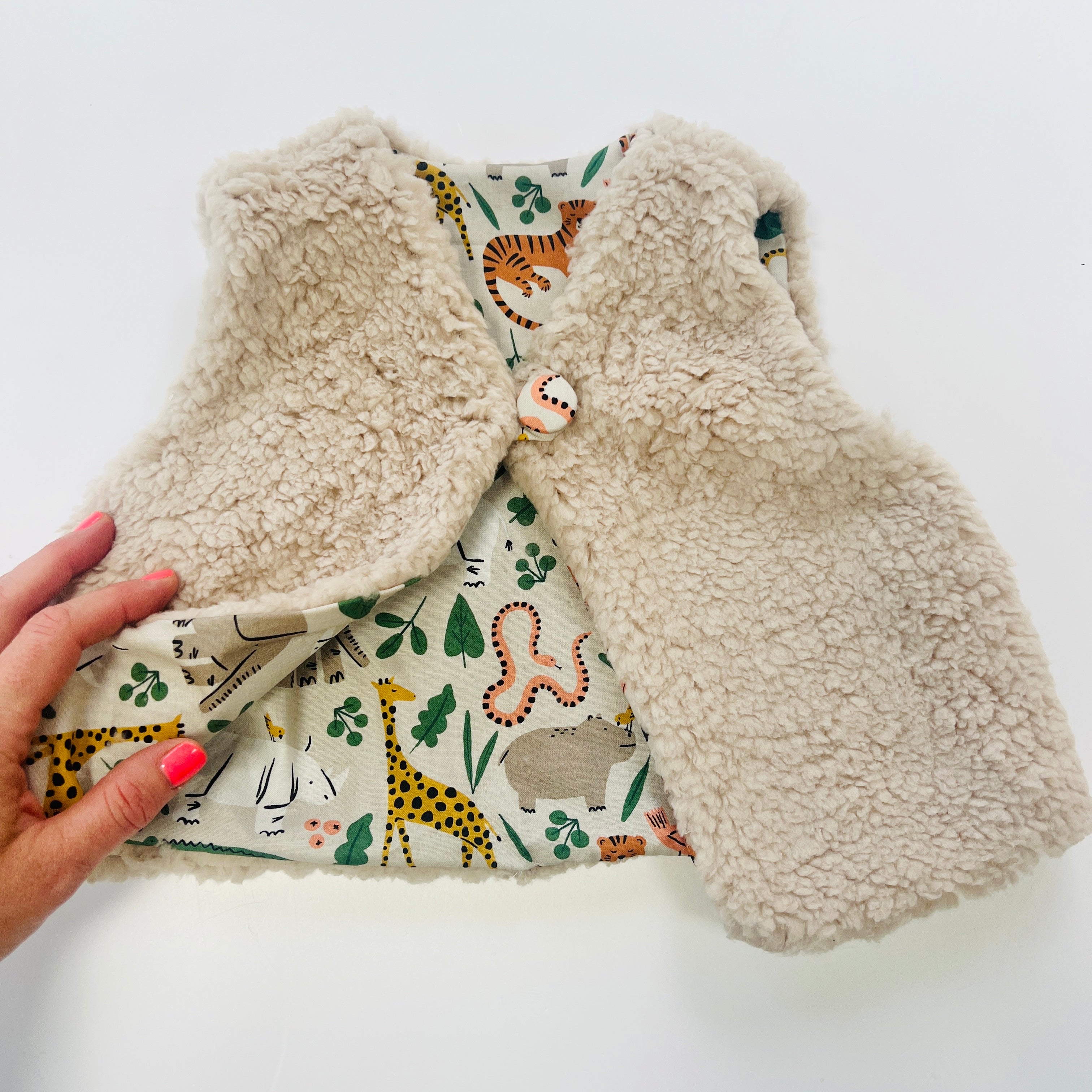 Fully Reversible fleecy gilet lined with your choice of print.