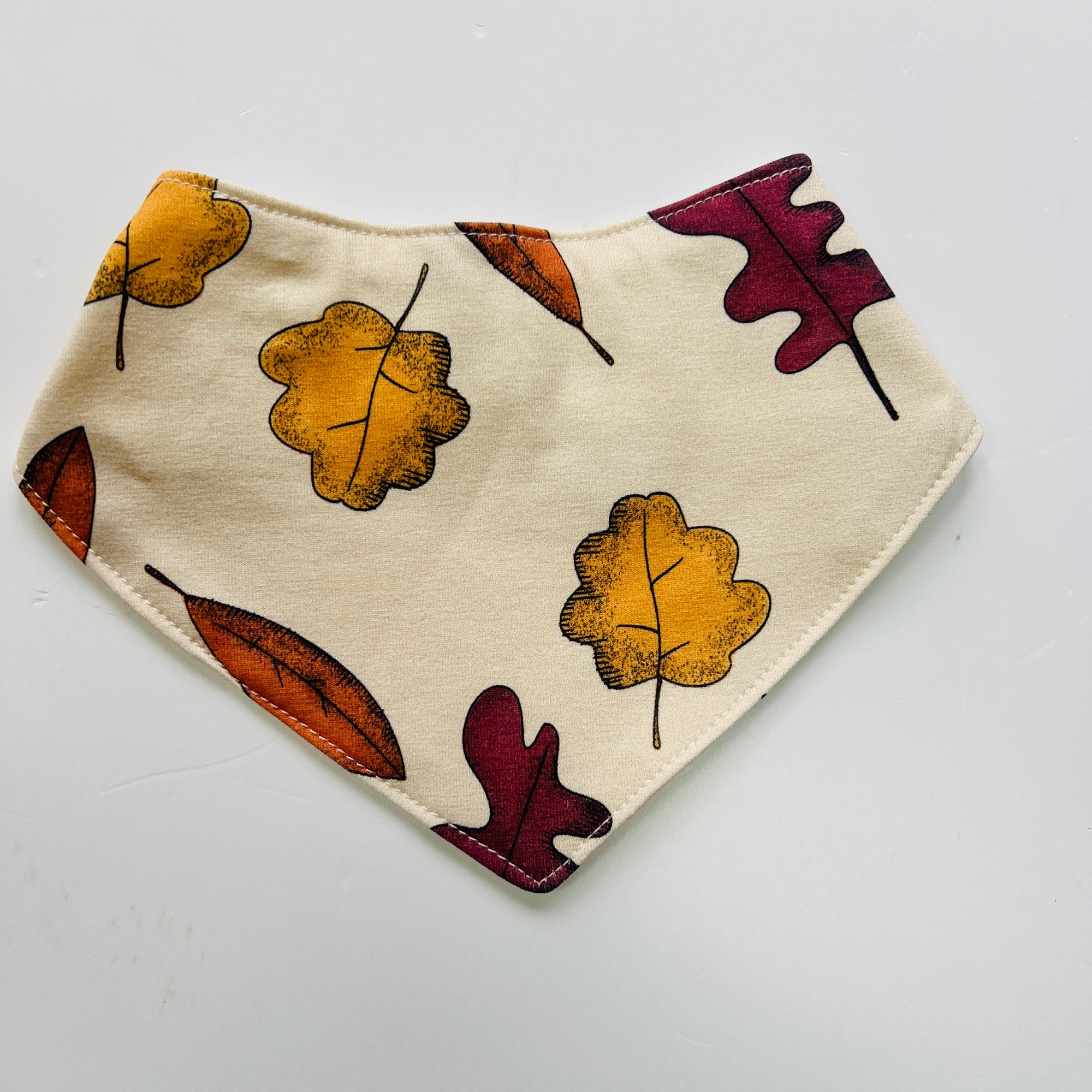 Eddie & Bee organic cotton Baby Dribble bib  in Butter Cream "Autumn Leaves" print.