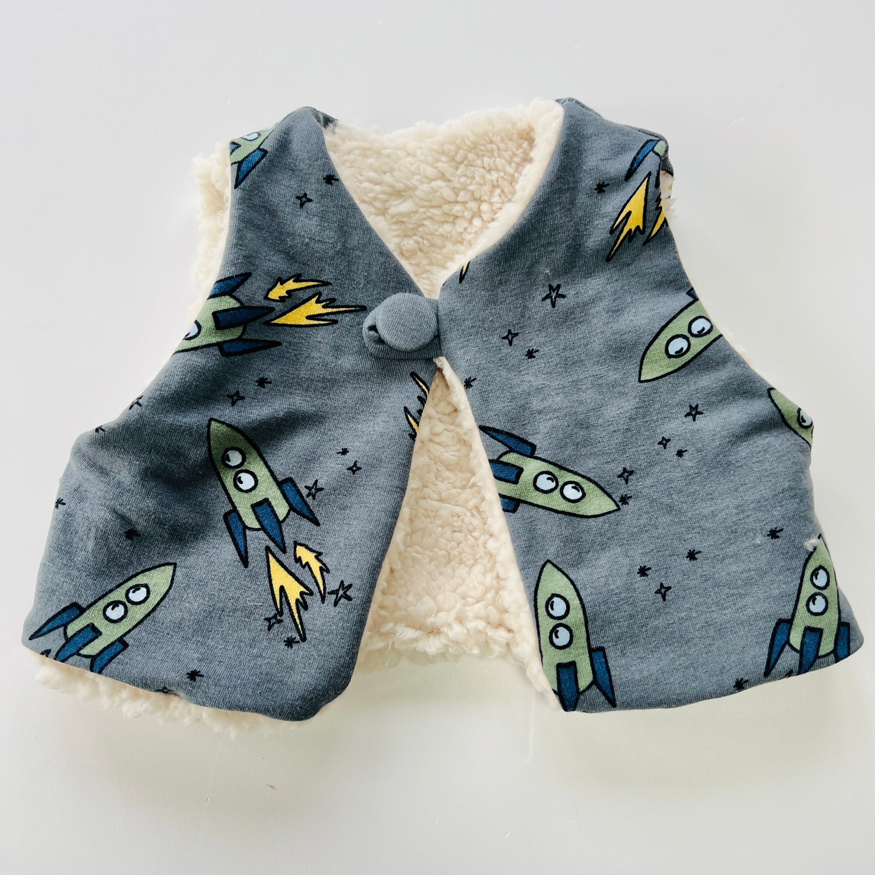 Fully Reversible fleecy gilet lined with your choice of print.