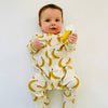 Eddie & Bee organic cotton Baby sleepsuit  in Cream " Banana " print.