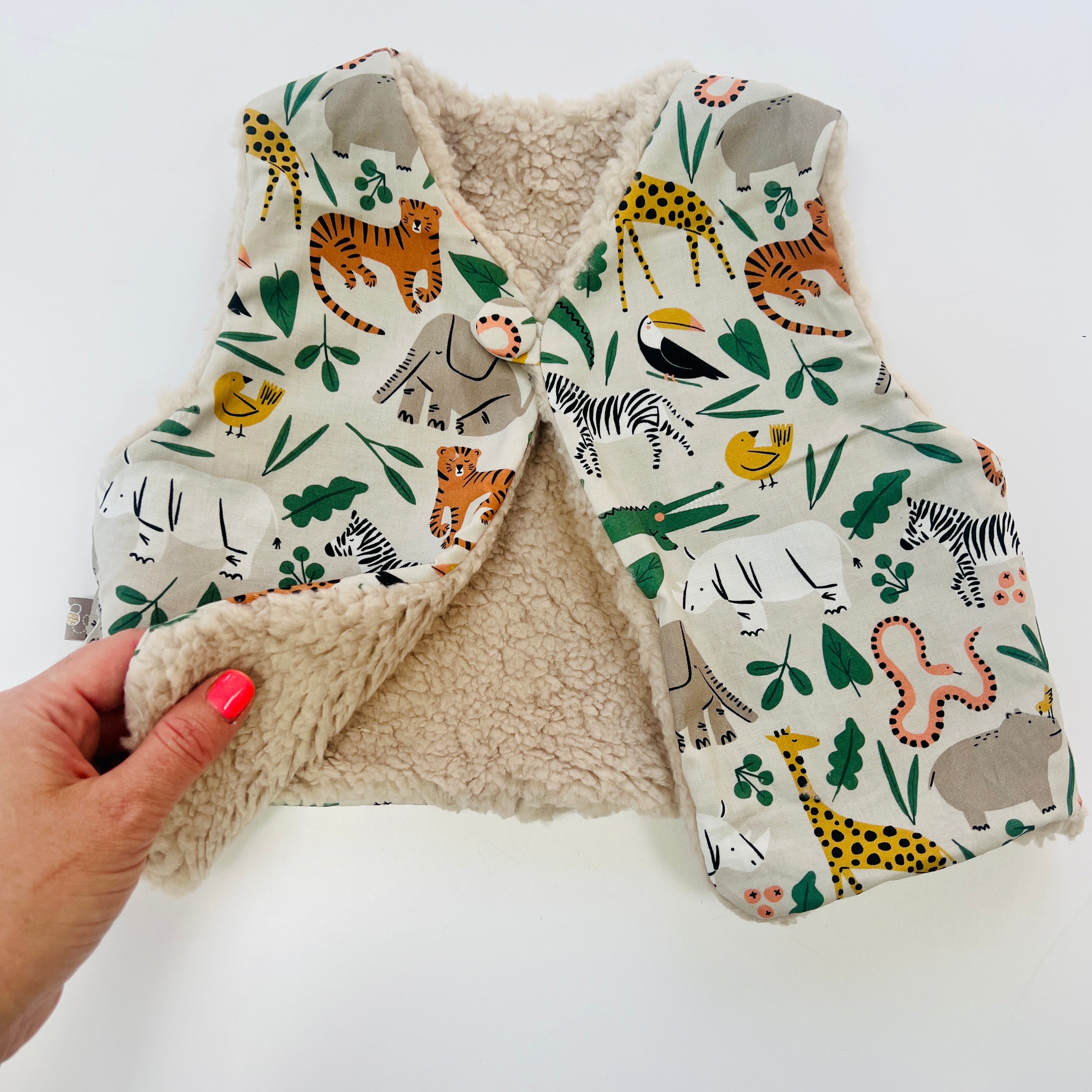 Fully Reversible fleecy gilet lined with your choice of print.