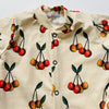 Eddie & Bee organic cotton Baby sleepsuit  in Butter cream  "Cherry " print.