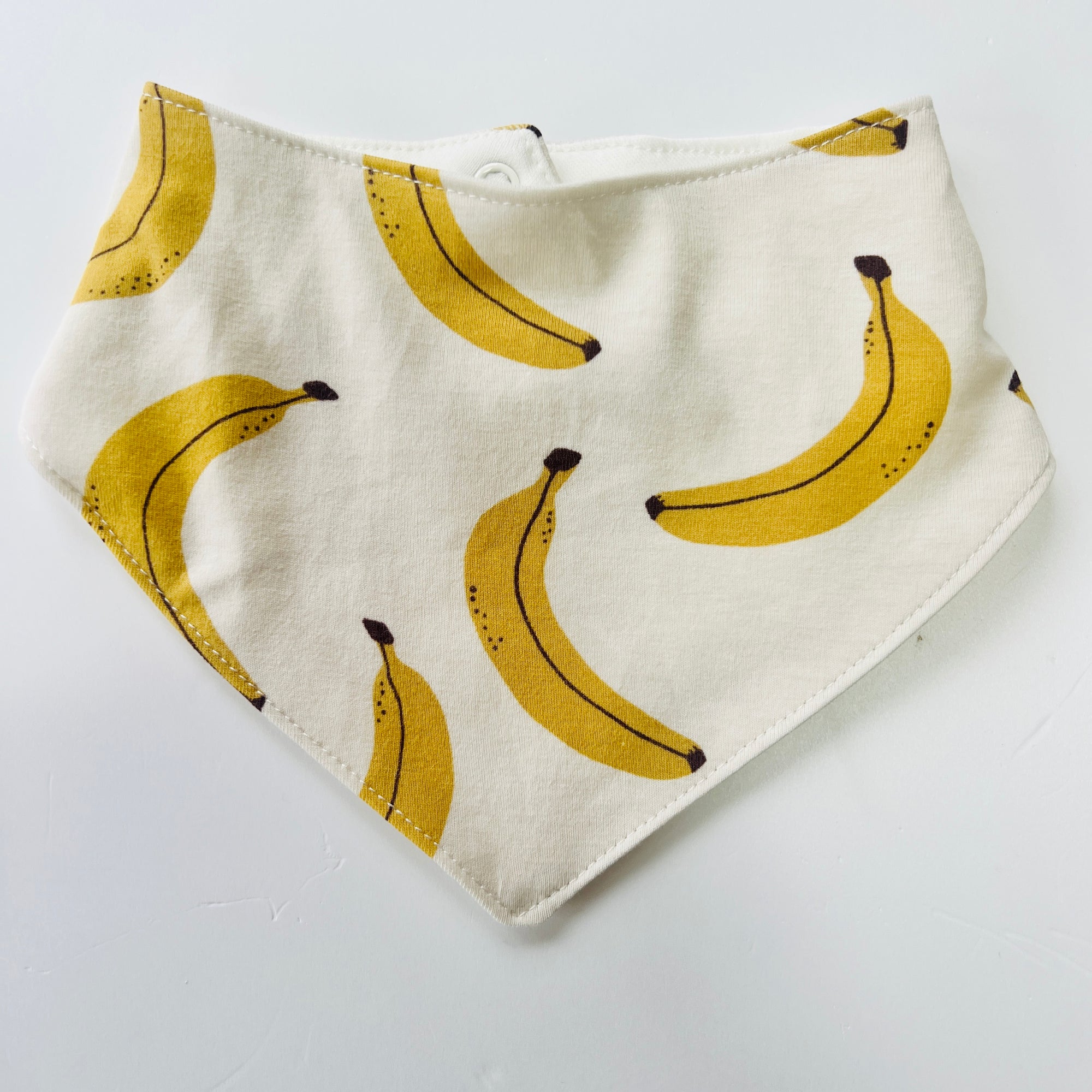 Eddie & Bee organic cotton Baby Dribble bib  in Cream "Banana" print.
