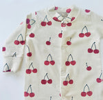Eddie & Bee organic cotton Baby sleepsuit  in Oat " Cherries " print.