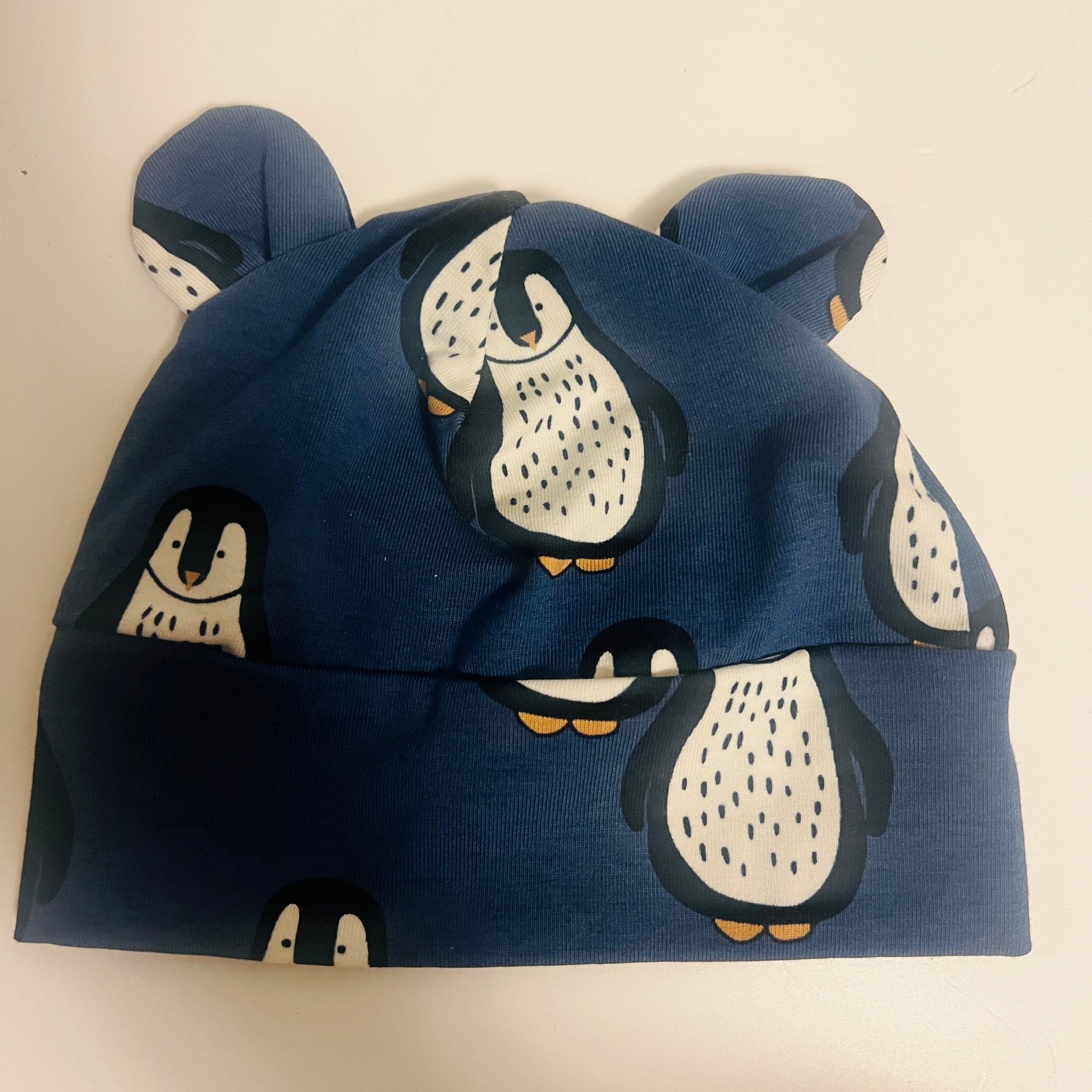 Eddie & Bee organic cotton Baby hat  in Blue "Penguin " print.