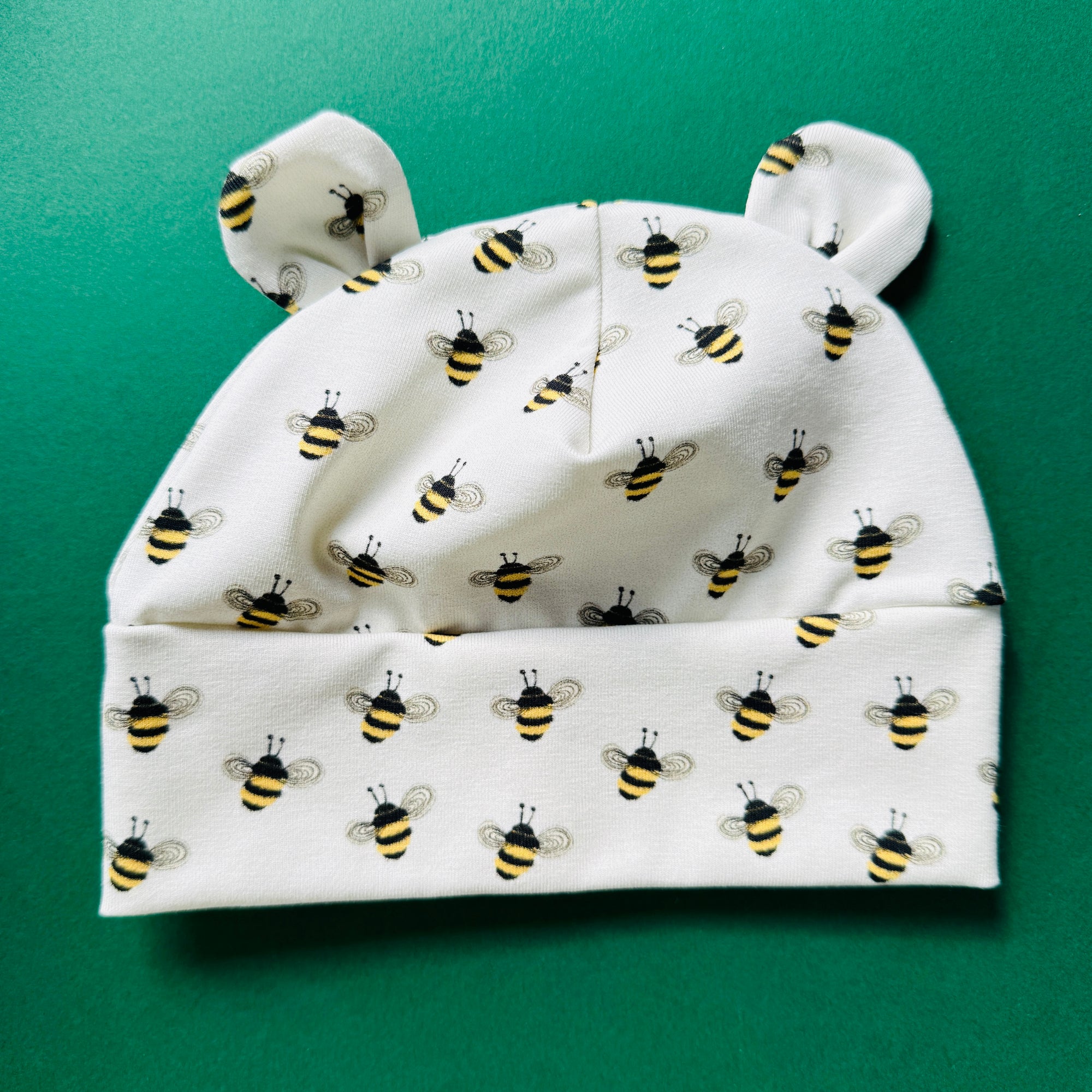 Eddie & Bee organic cotton Baby hat with ears  in Cream " Bees" print.