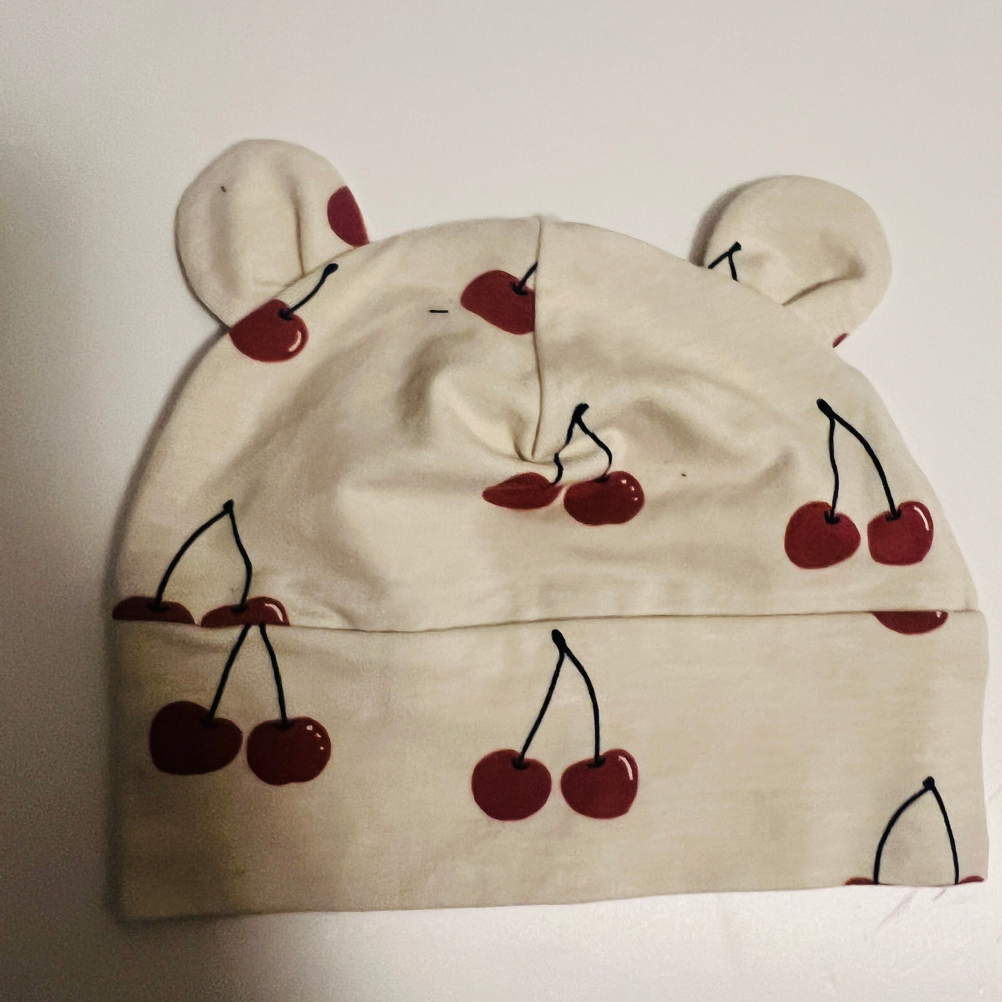 Eddie & Bee organic cotton Baby hat  in Cream " Cherry" print.