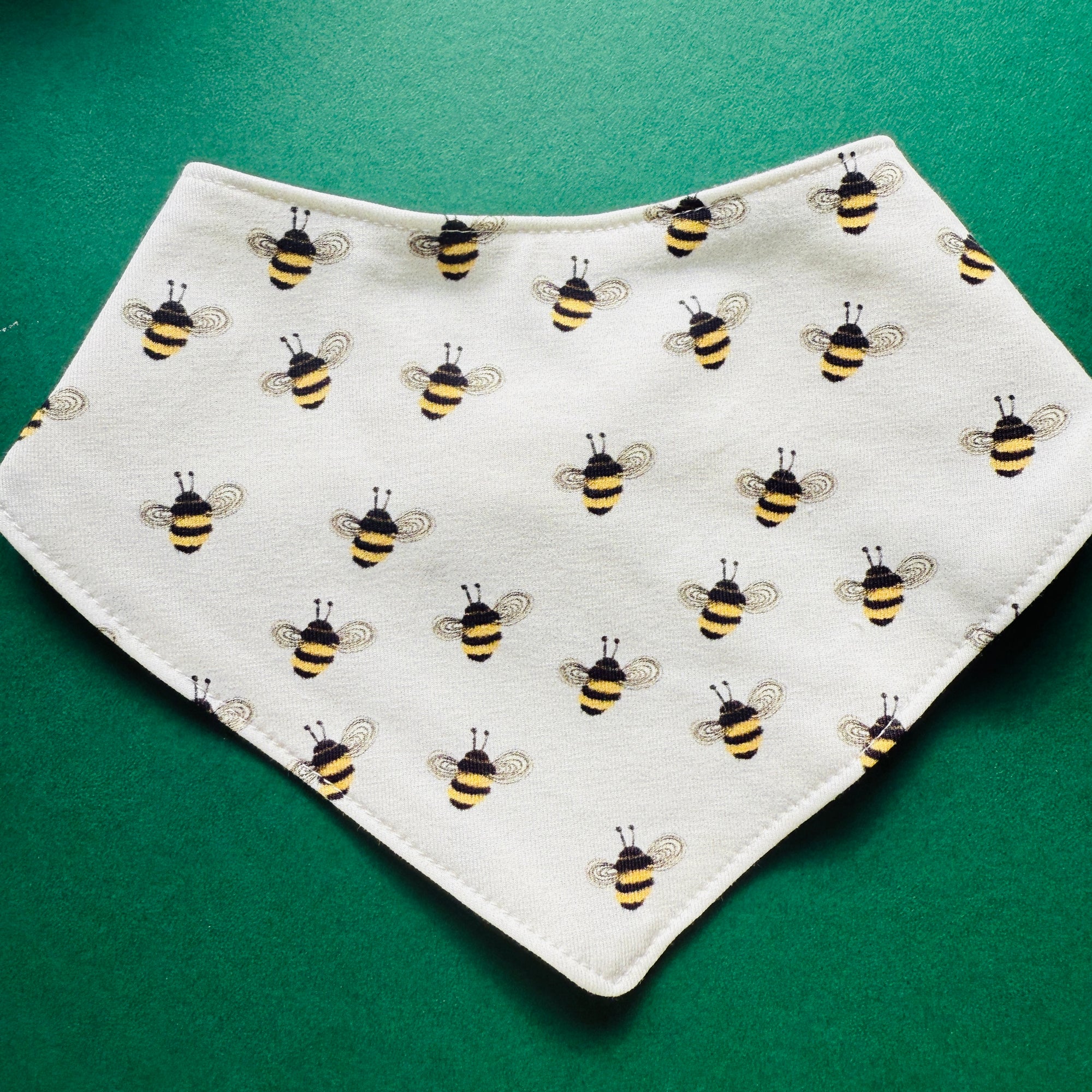 Eddie & Bee organic cotton Baby Dribble bib  in Cream "Bees" print.