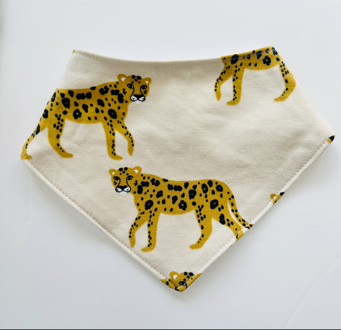 Eddie & Bee organic cotton Baby Dribble bib  in Oat "Cheetah" print.