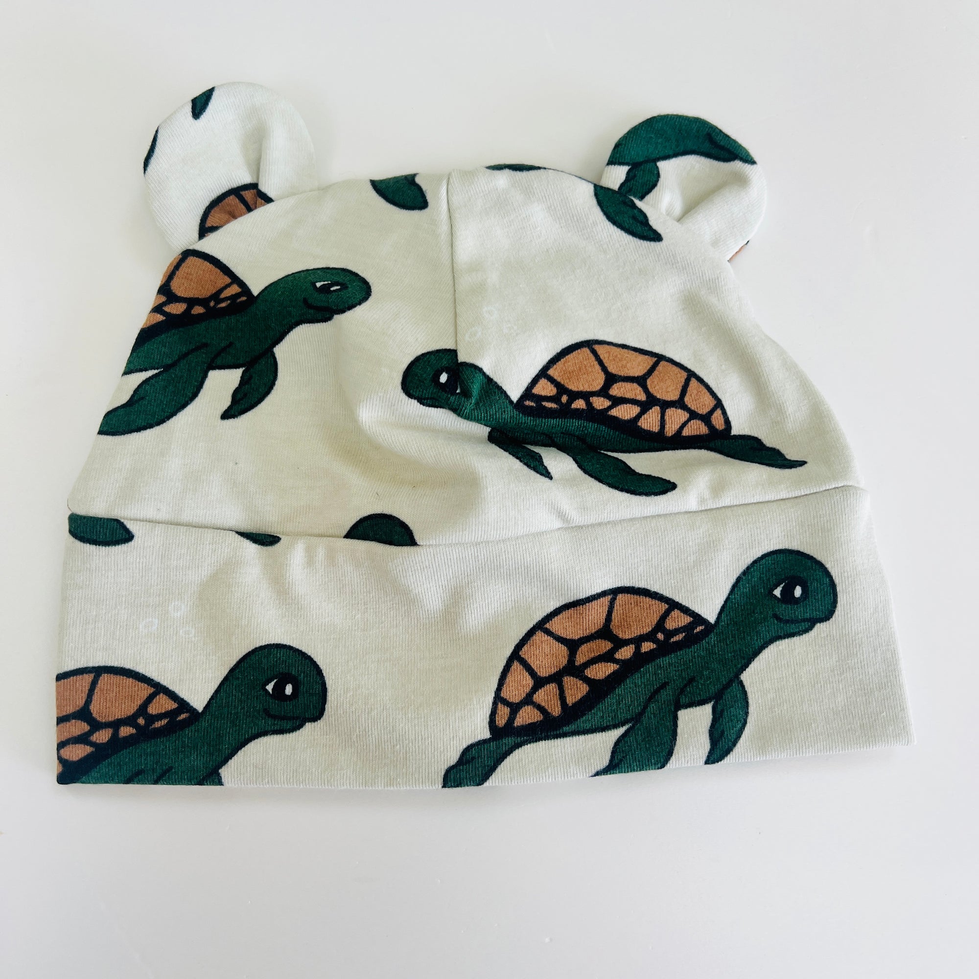Eddie & Bee organic cotton Baby hat with ears  in Oat "Swimming Turtle" print.