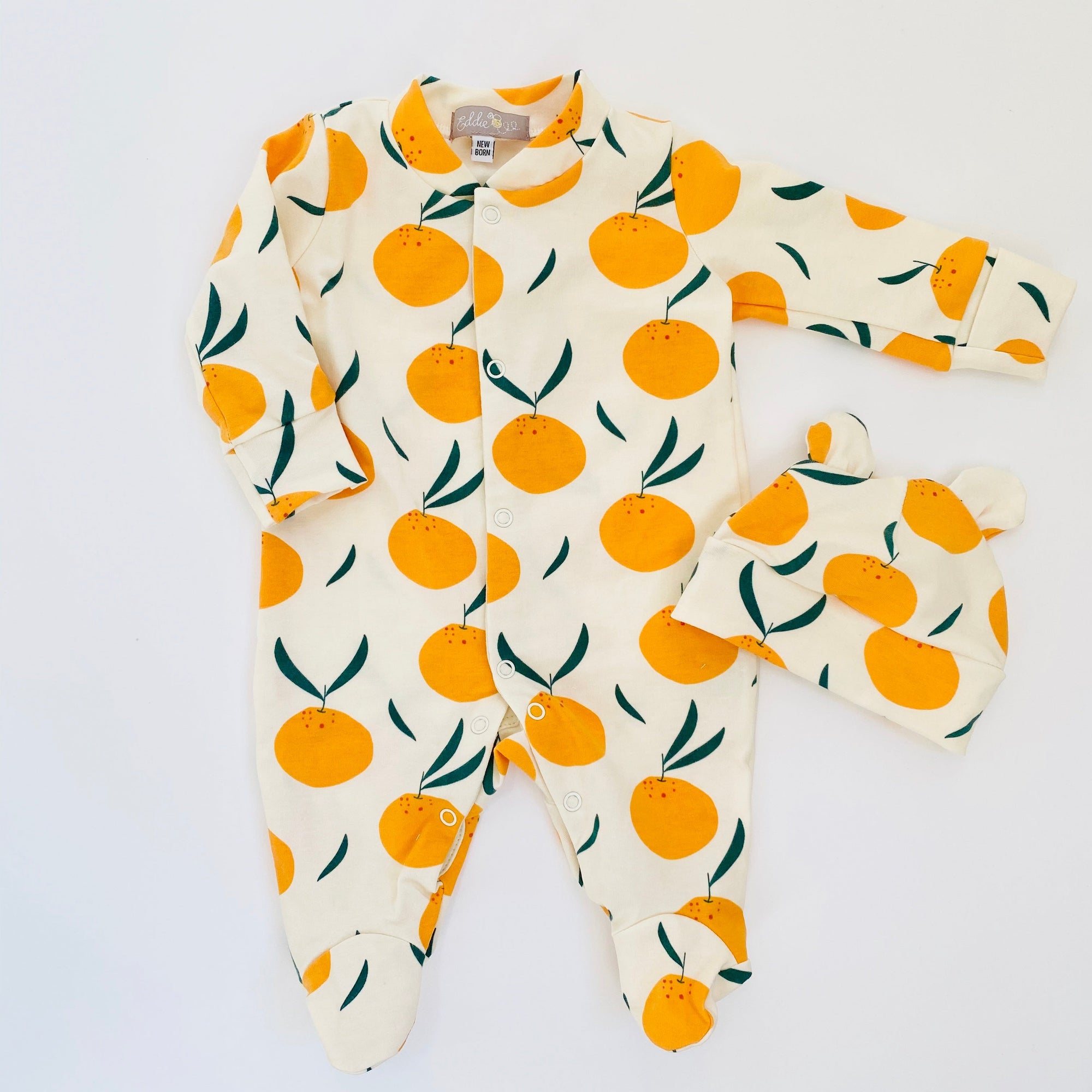 Eddie & Bee organic cotton Baby sleepsuit  in Cream " Clementine grove " print.