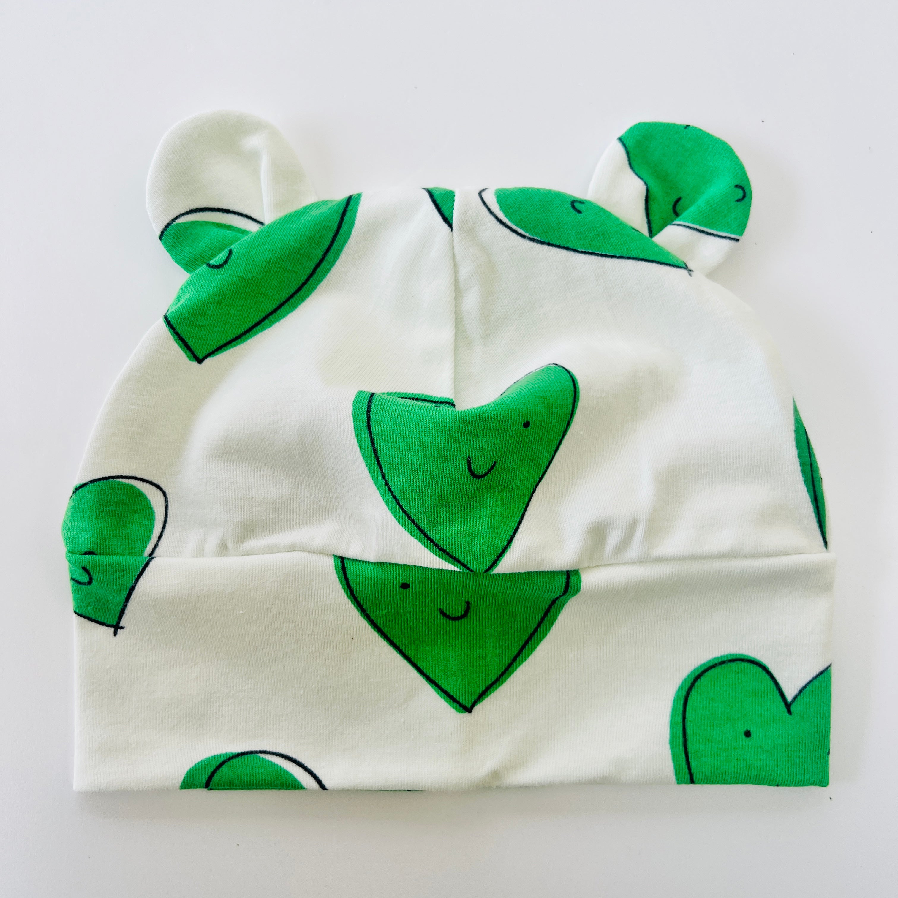 Eddie & Bee organic cotton Baby hat with ears  in Green " Happy hearts" print.