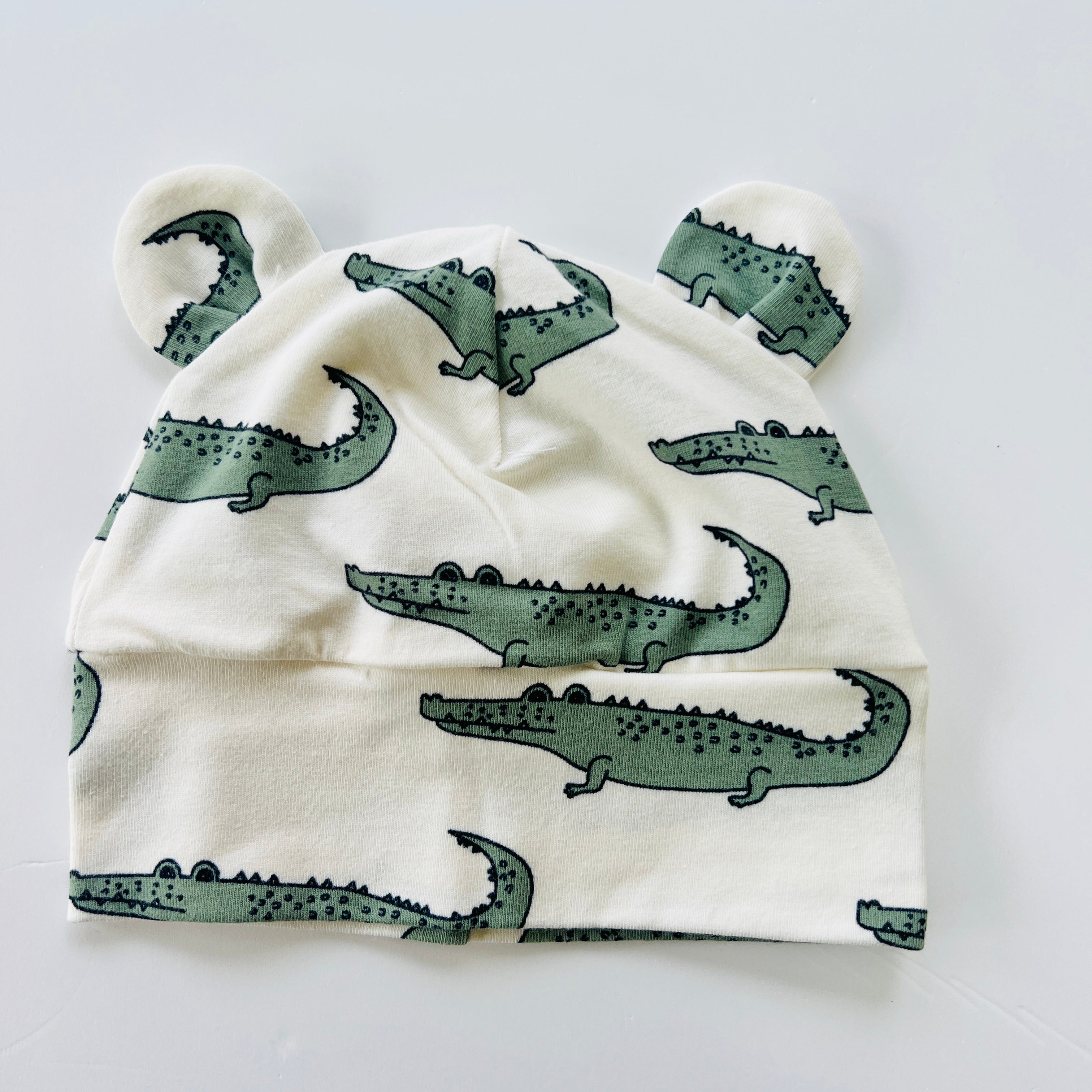 Eddie & Bee organic cotton Baby hat  in Cream " Ginormous Crocodile" print.