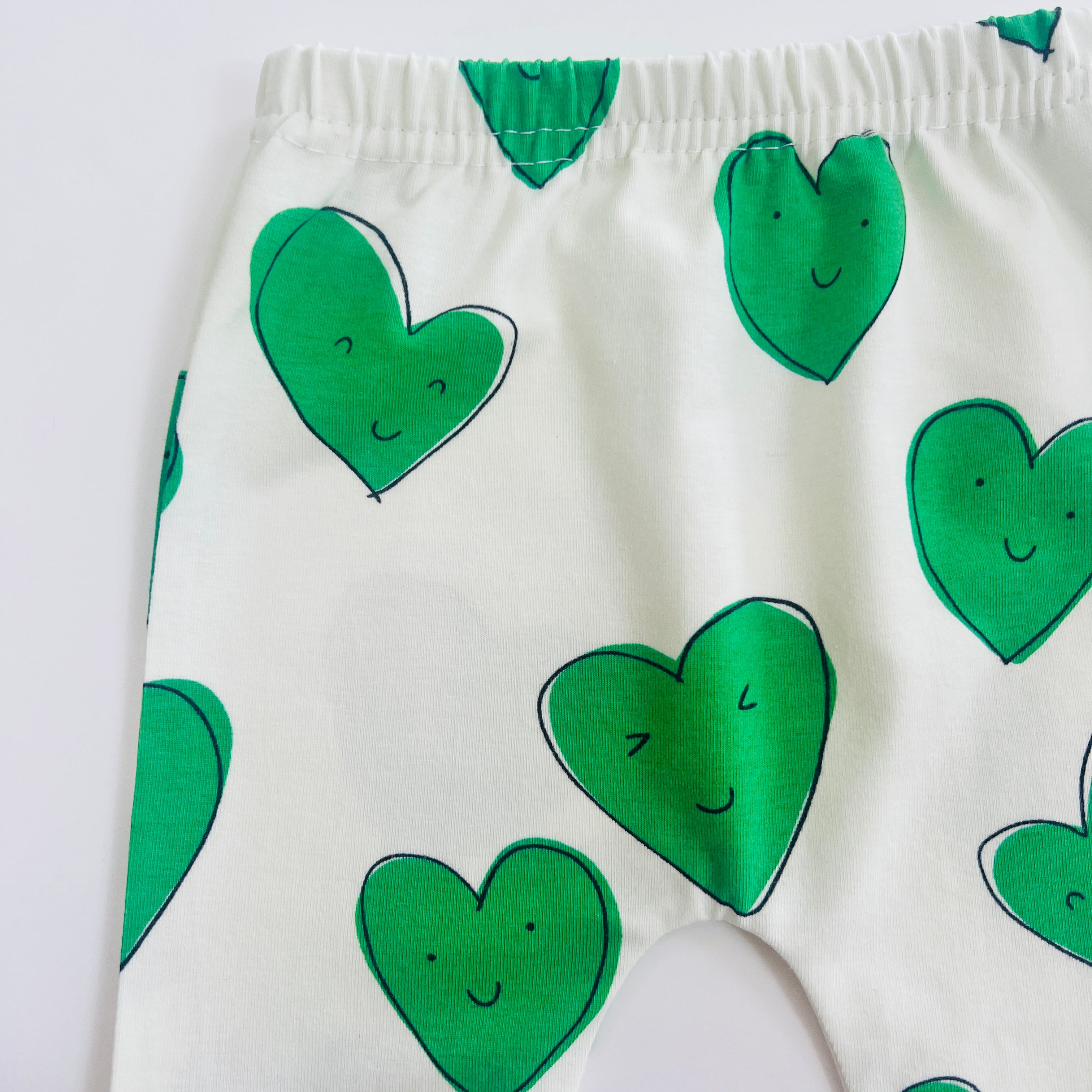 Eddie & Bee organic cotton leggings in Green "Happy Hearts" print.