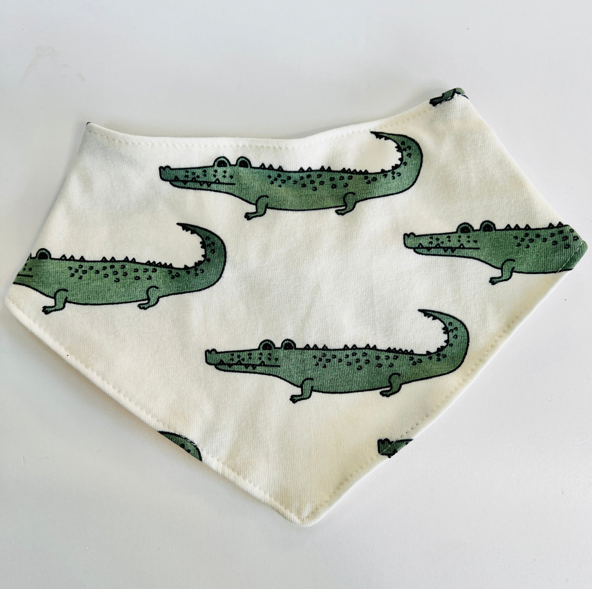 Eddie & Bee organic cotton Baby Dribble bib  in Cream "Enormous Crocodile" print.
