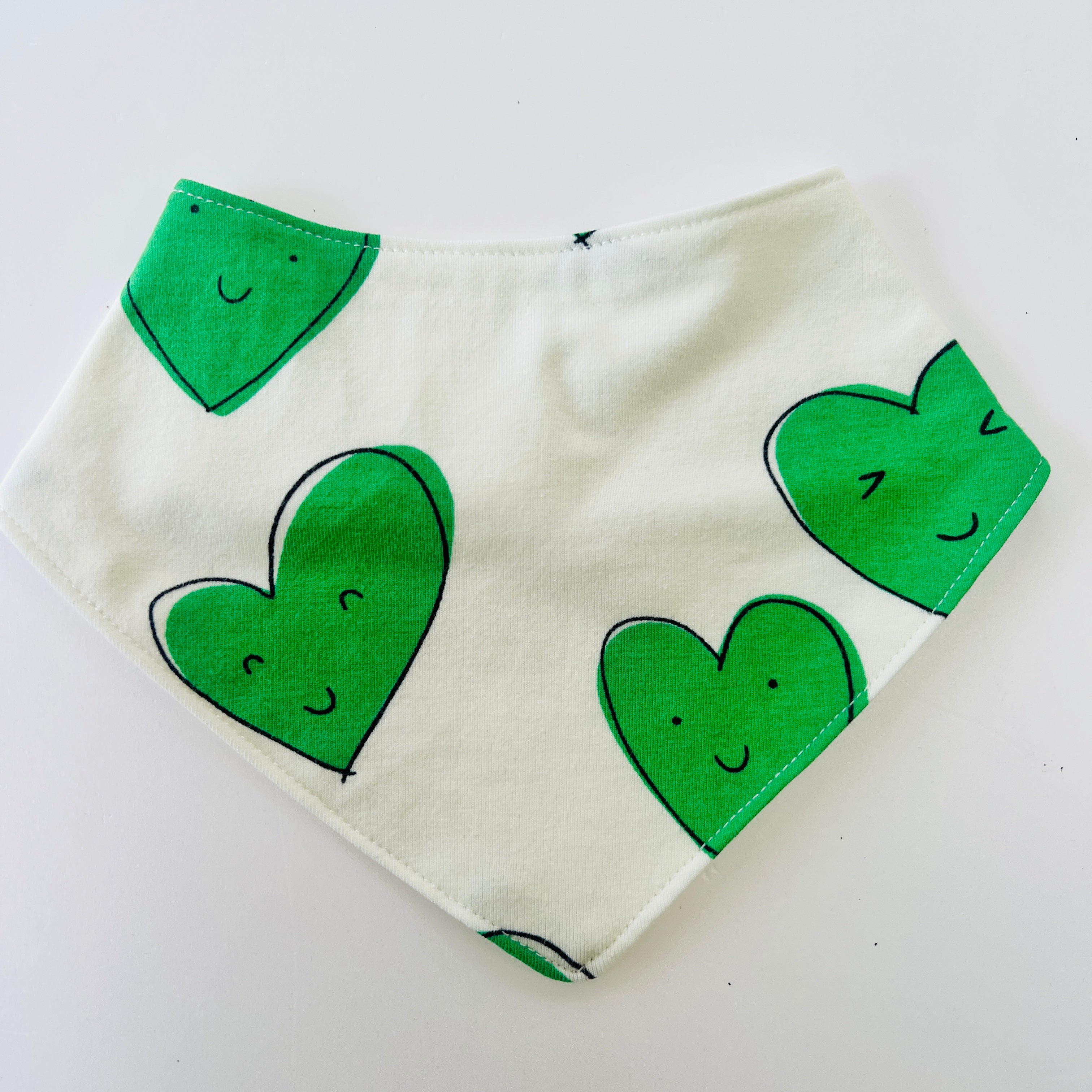 Eddie & Bee organic cotton Baby Dribble bib  in Green "Happy Hearts" print.