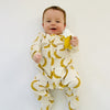 Eddie & Bee organic cotton Baby sleepsuit  in Cream " Banana " print.