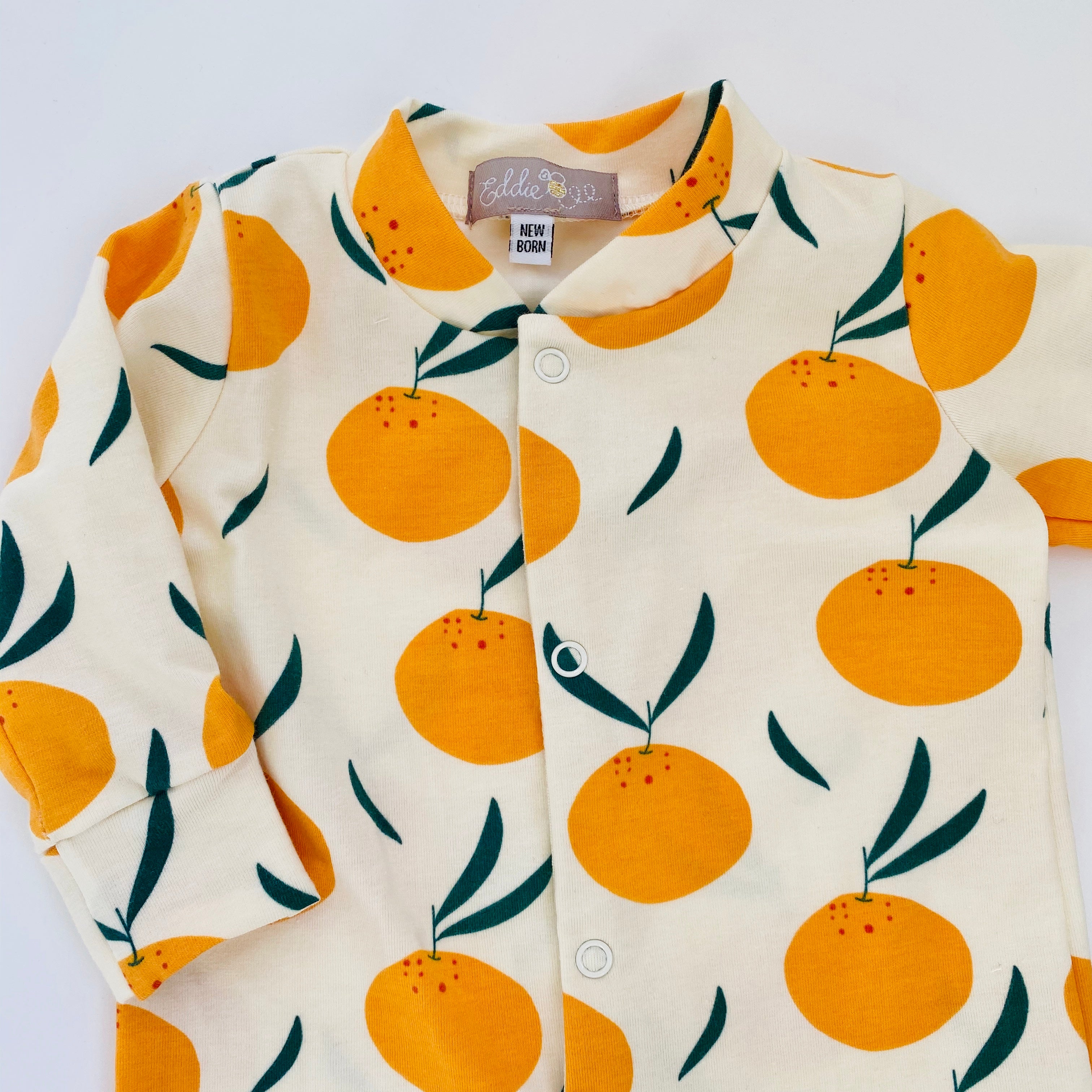 Eddie & Bee organic cotton Baby sleepsuit  in Cream " Clementine grove " print.