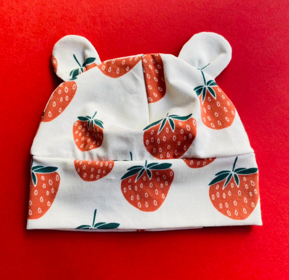 Eddie & Bee organic cotton Baby hat with ears  in Cream " Strawberry" print.