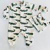Pre-order for delivery end of September - Eddie & Bee organic cotton Baby sleep suit  in Cream " Enormous Crocodile" print.