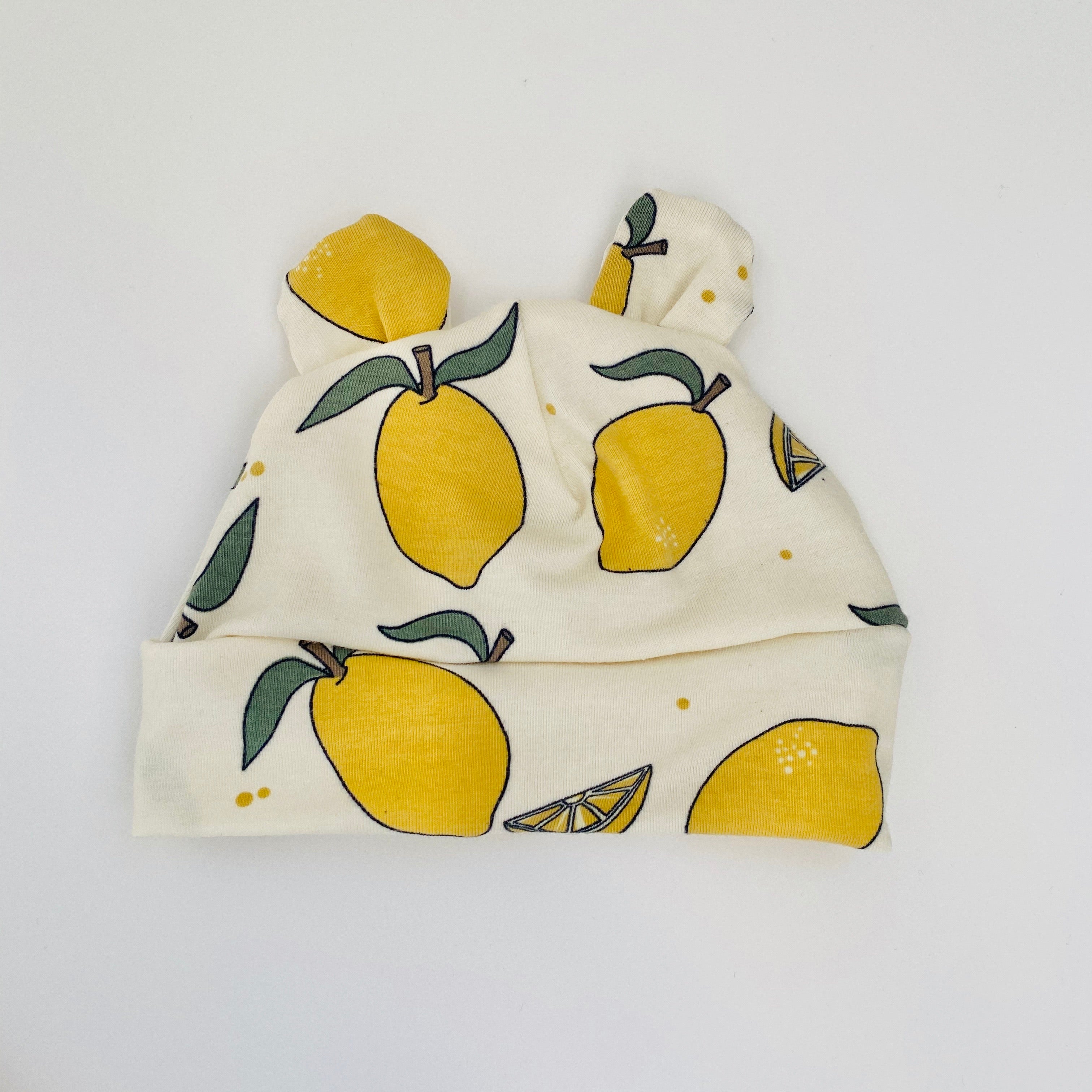 Eddie & Bee organic cotton Baby hat with ears  in Cream " Lemon Grove” print.