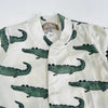 Pre-order for delivery end of September - Eddie & Bee organic cotton Baby sleep suit  in Cream " Enormous Crocodile" print.