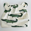Pre-order for delivery end of September - Eddie & Bee organic cotton Baby sleep suit  in Cream " Enormous Crocodile" print.