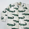 Pre-order for delivery end of September - Eddie & Bee organic cotton Baby sleep suit  in Cream " Enormous Crocodile" print.